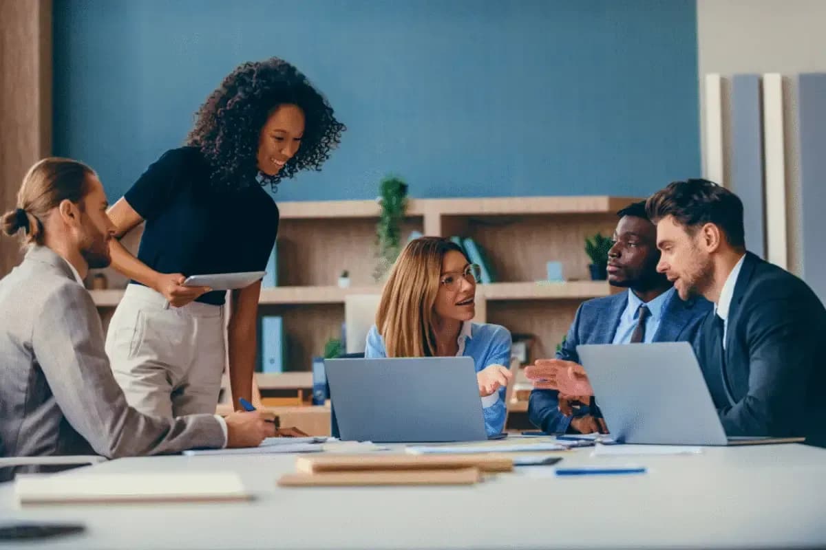 A team reviewing work together in an office